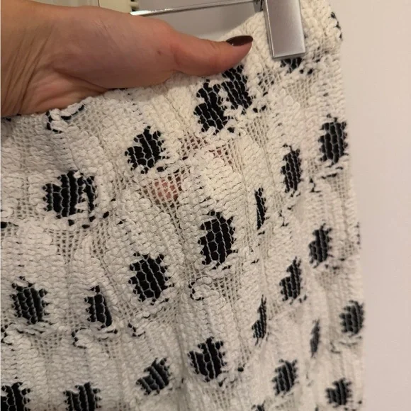 AREA eye crochet knit pants featuring crystal flower applique